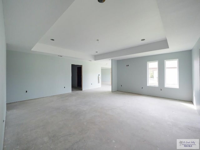 spare room featuring a raised ceiling