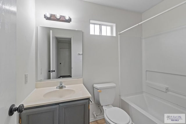 3017 Paradise Ave, Harlingen, TX 78552 - bathroom with toilet, vanity, and shower / washtub combination