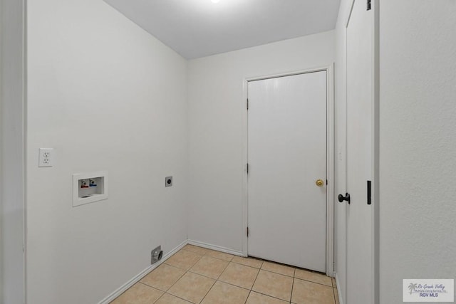3017 Paradise Ave, Harlingen, TX 78552 - laundry area with washer hookup, hookup for an electric dryer, and light tile patterned floors