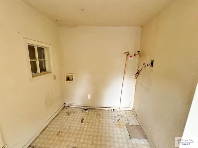 309 E Polk Ave, Harlingen, TX 78550 - laundry area featuring hookup for a washing machine, light floors, and baseboards
