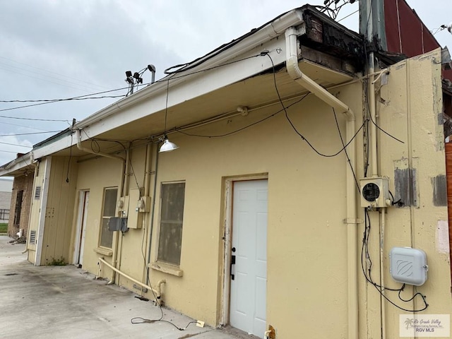 view of side of property with a patio area