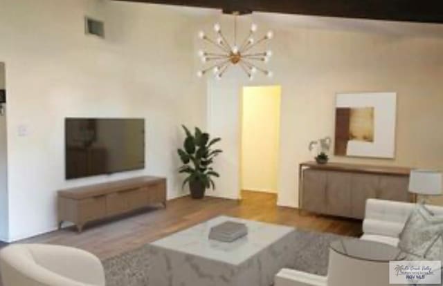 2201 Emerald Lake Dr, Harlingen, TX 78550 - living area with a chandelier and wood finished floors