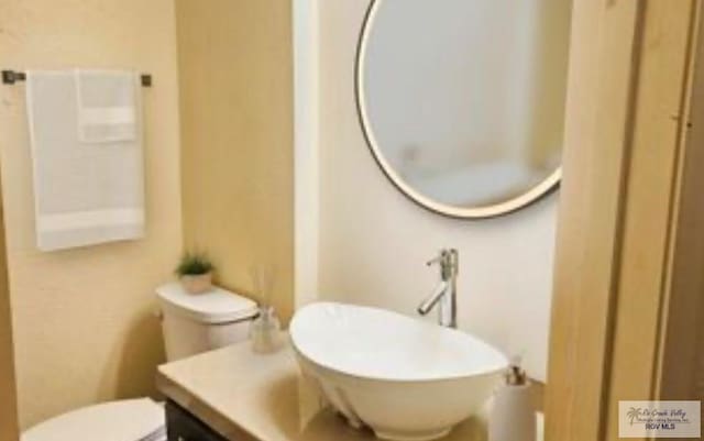 2201 Emerald Lake Dr, Harlingen, TX 78550 - bathroom featuring vanity and toilet