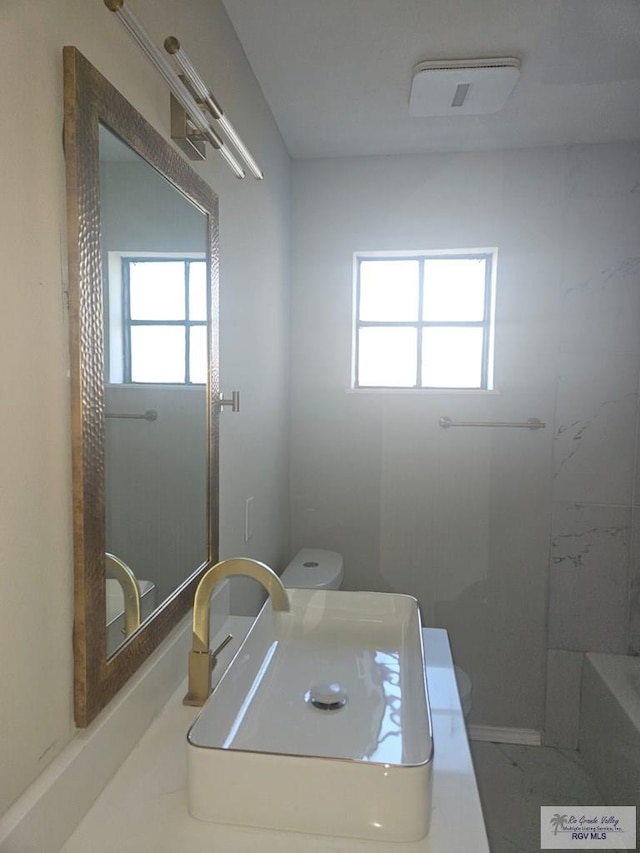 1115 Falcon Dr, Harlingen, TX 78550 - bathroom with healthy amount of natural light and a shower