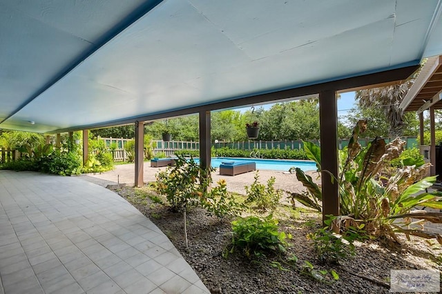 view of swimming pool featuring a patio area