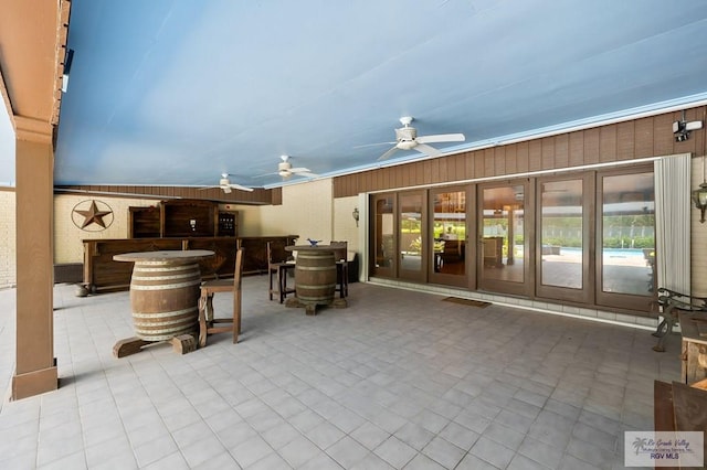 view of patio / terrace featuring french doors and ceiling fan