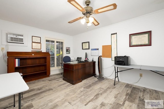 office with light wood-type flooring, a wall unit AC, ceiling fan, and ornamental molding