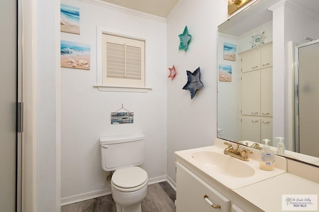 bathroom featuring crown molding, an enclosed shower, toilet, vanity, and hardwood / wood-style flooring