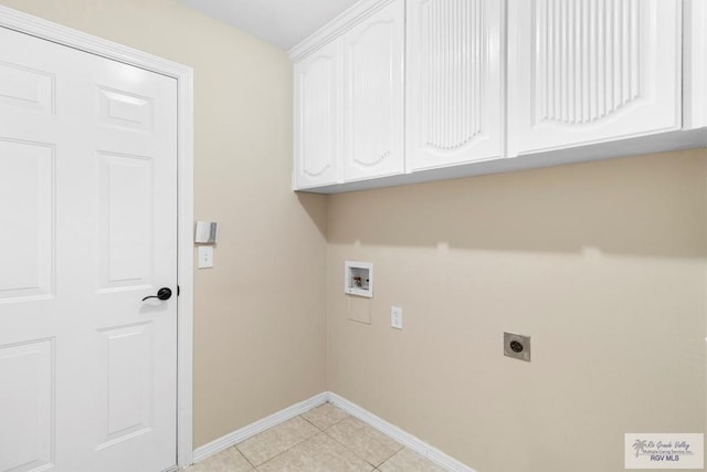 laundry room featuring hookup for an electric dryer, washer hookup, light tile patterned floors, and cabinets