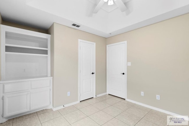 unfurnished bedroom featuring light tile patterned floors, a closet, and ceiling fan