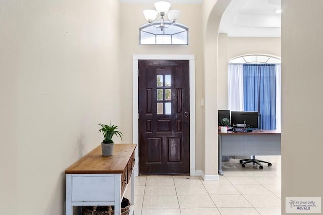 foyer entrance with light tile patterned floors