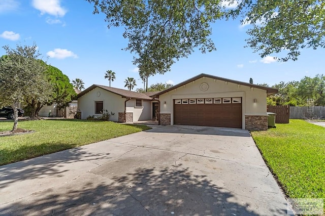 ranch-style house featuring a front yard and a garage