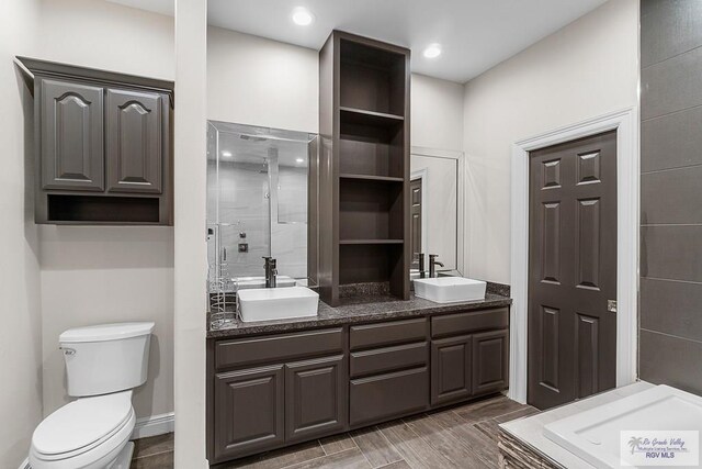 bathroom featuring hardwood / wood-style floors, vanity, and toilet