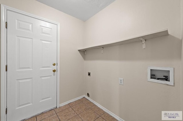 2344 Munich St, Brownsville, TX 78520 - laundry room featuring washer hookup, electric dryer hookup, and light tile patterned floors
