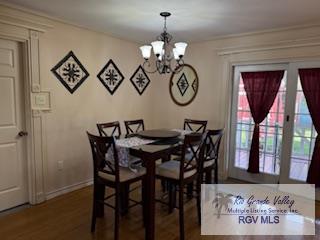 dining room featuring a notable chandelier and hardwood / wood-style floors