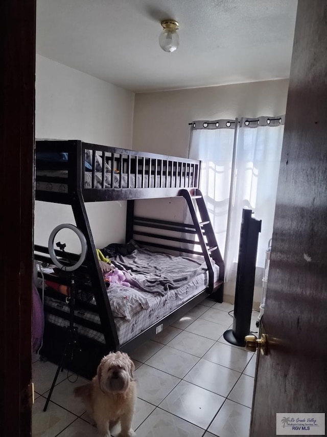 bedroom with tile patterned flooring