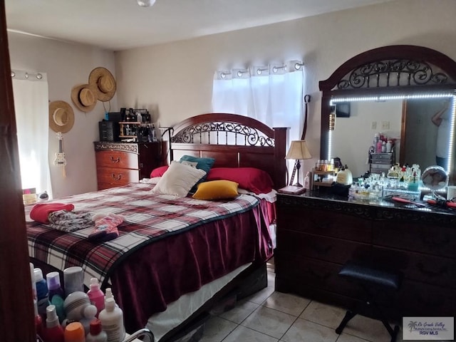 bedroom with light tile patterned flooring