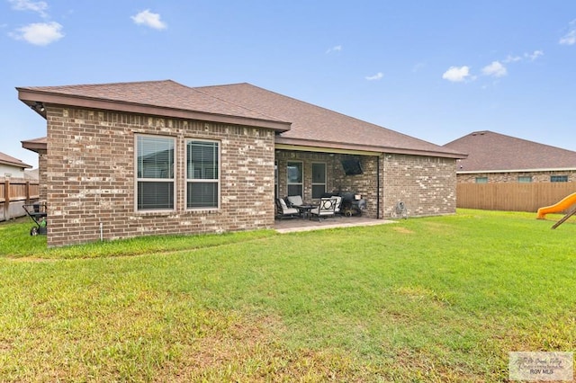 16756 E Barger Ct, Harlingen, TX 78552 - rear view of property featuring brick siding, a patio area, roof with shingles, and a playground