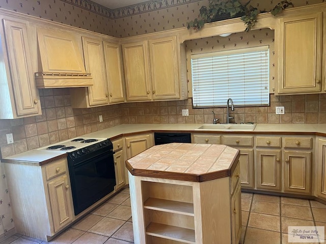 kitchen with sink, electric range, tile countertops, black dishwasher, and a kitchen island