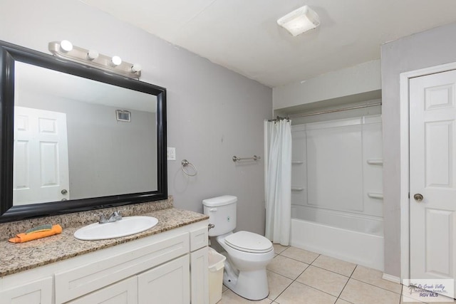 full bathroom featuring tile patterned flooring, vanity, toilet, and shower / bath combo with shower curtain