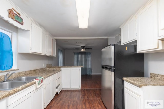 kitchen featuring stainless steel refrigerator, white cabinetry, ceiling fan, sink, and dark hardwood / wood-style flooring