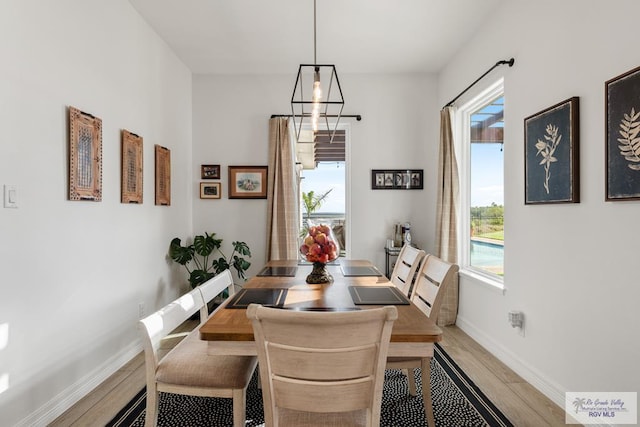 dining area with a healthy amount of sunlight and light wood-type flooring