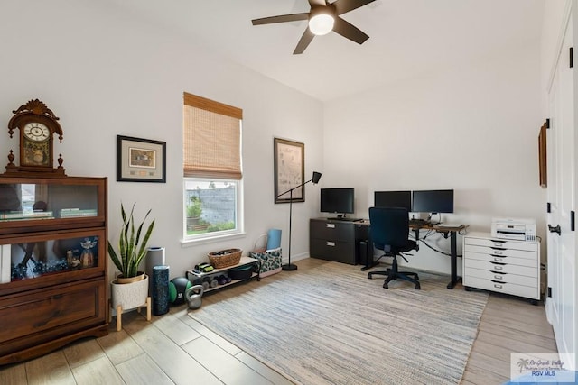 office space featuring ceiling fan and light wood-type flooring