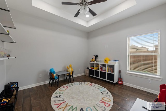 rec room featuring ceiling fan and a tray ceiling