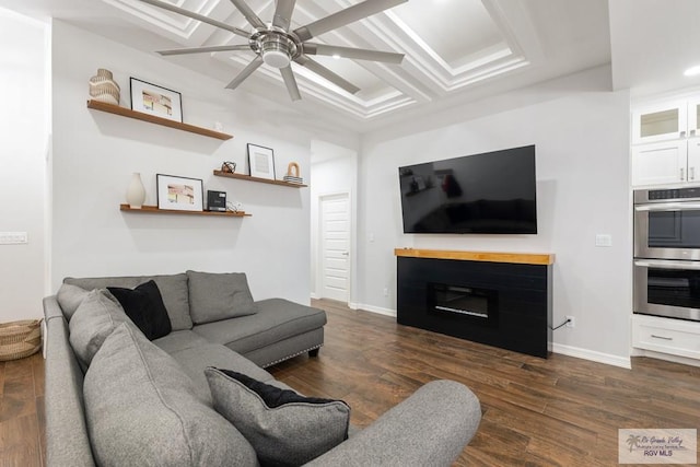 living room featuring ceiling fan and dark wood-type flooring