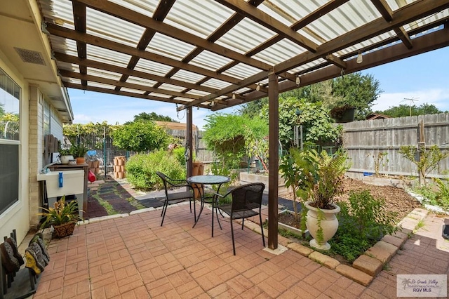 view of patio featuring a pergola