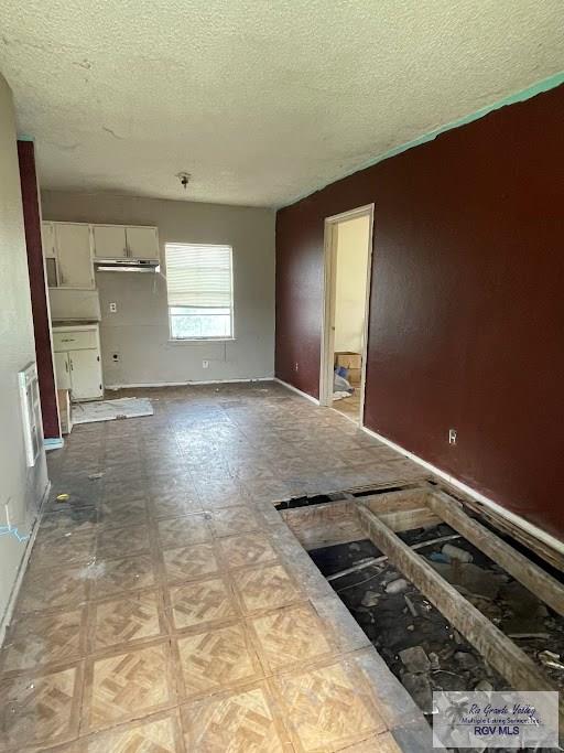 interior space featuring a textured ceiling