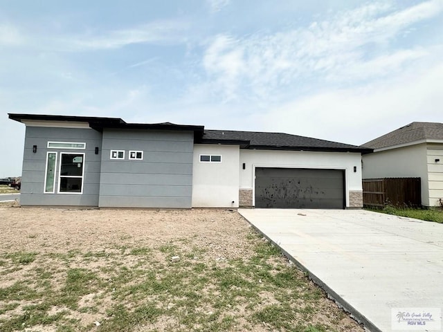 prairie-style house featuring a garage