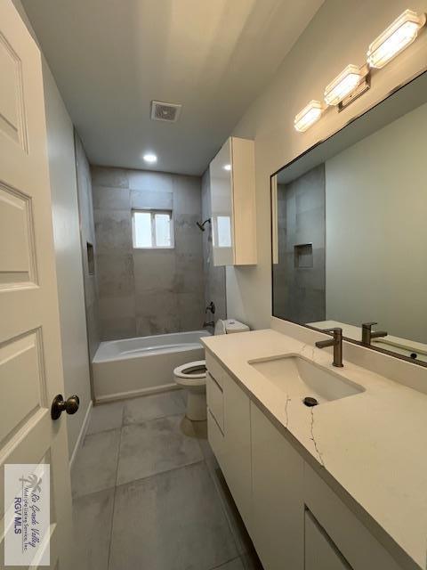 4031 Tito Ct Unit 45, Brownsville, TX 78521 - bathroom with recessed lighting, bathtub / shower combination, toilet, vanity, and visible vents