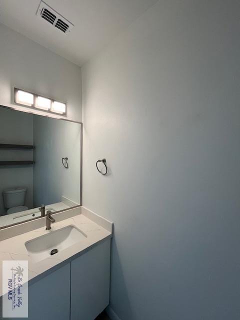 4031 Tito Ct Unit 45, Brownsville, TX 78521 - half bath with visible vents, toilet, and vanity