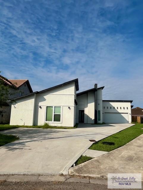 4031 Tito Ct Unit 45, Brownsville, TX 78521 - contemporary home featuring driveway and stucco siding