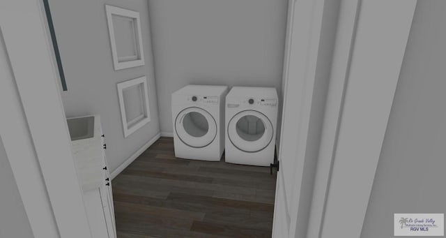 washroom with washer and clothes dryer and dark wood-type flooring