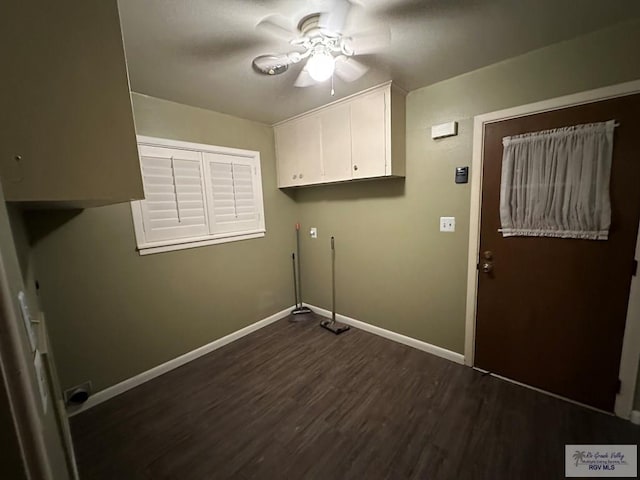 washroom with dark hardwood / wood-style flooring, cabinets, and ceiling fan