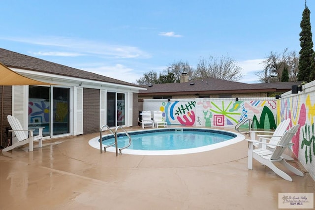 1215 Bluebonnet Dr, Brownsville, TX 78521 - view of swimming pool featuring a patio area