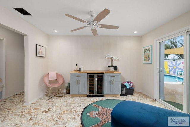 1215 Bluebonnet Dr, Brownsville, TX 78521 - indoor dry bar featuring wine cooler, a ceiling fan, recessed lighting, and baseboards