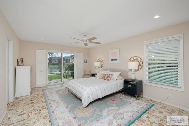 1215 Bluebonnet Dr, Brownsville, TX 78521 - bedroom featuring access to exterior, baseboards, ceiling fan, stone finish floors, and recessed lighting