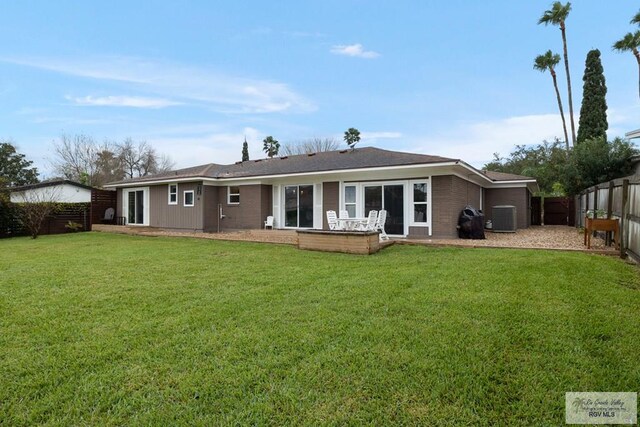 1215 Bluebonnet Dr, Brownsville, TX 78521 - back of house with central air condition unit