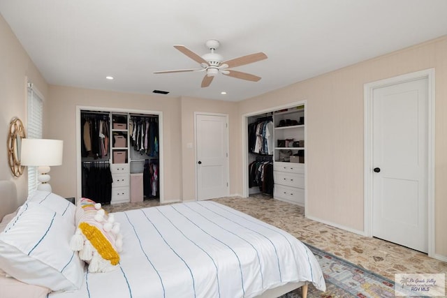1215 Bluebonnet Dr, Brownsville, TX 78521 - bedroom with two closets, recessed lighting, ceiling fan, and baseboards