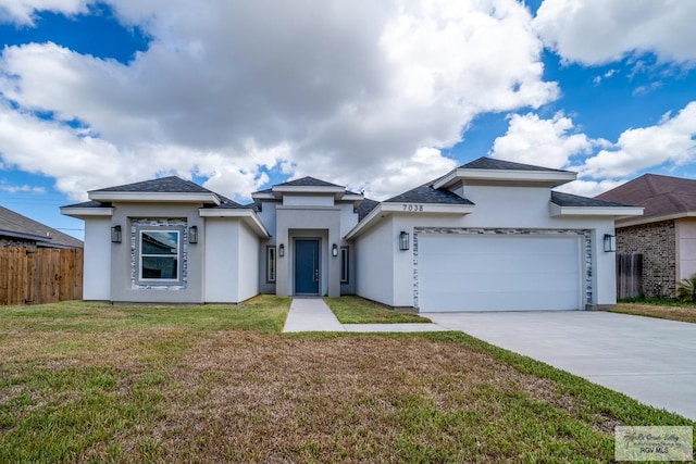 view of front of house with a garage and a front lawn