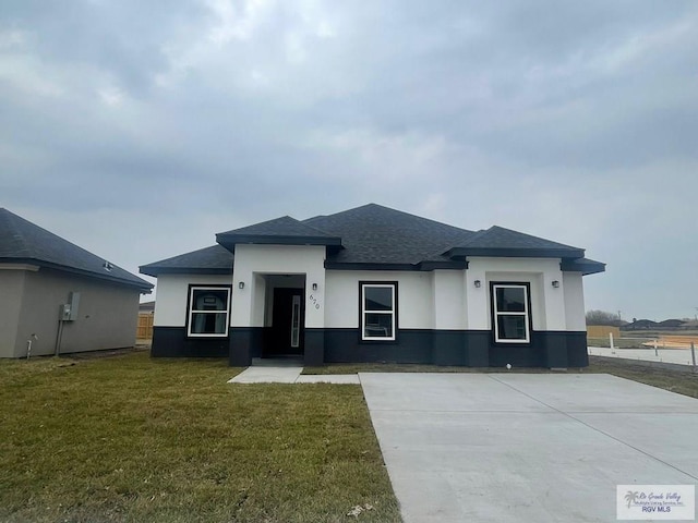 prairie-style house with a front yard