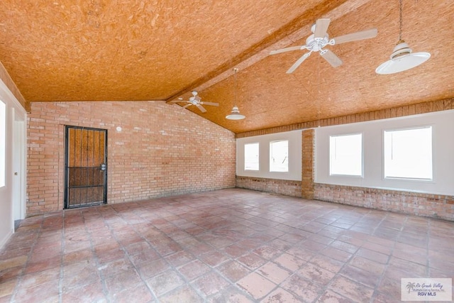 115 E Armstrong Ct, Brownsville, TX 78521 - spare room featuring brick wall, ceiling fan, and tile patterned floors