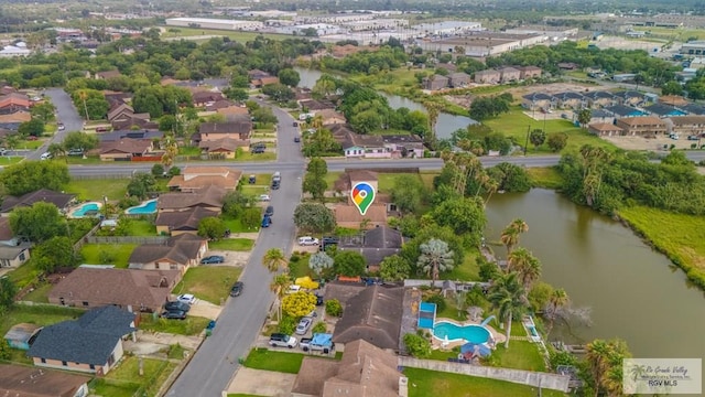 115 E Armstrong Ct, Brownsville, TX 78521 - aerial overview of property's location with a nearby body of water, a pool area, and nearby suburban area