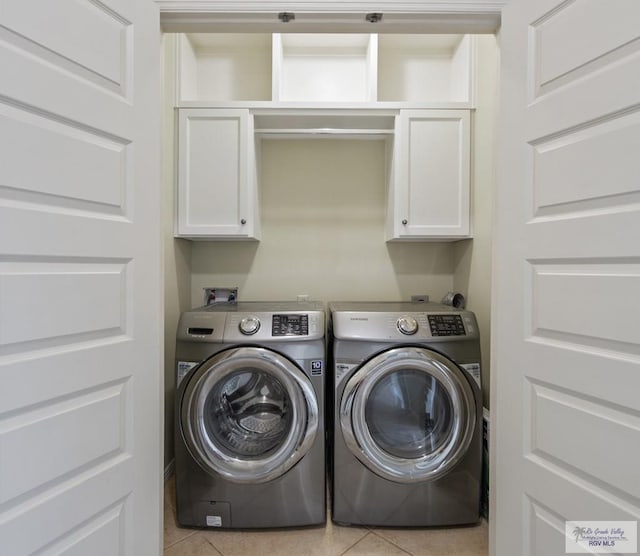 7136 Arroyo Blvd, Brownsville, TX 78526 - laundry room with cabinet space, light tile patterned floors, and independent washer and dryer