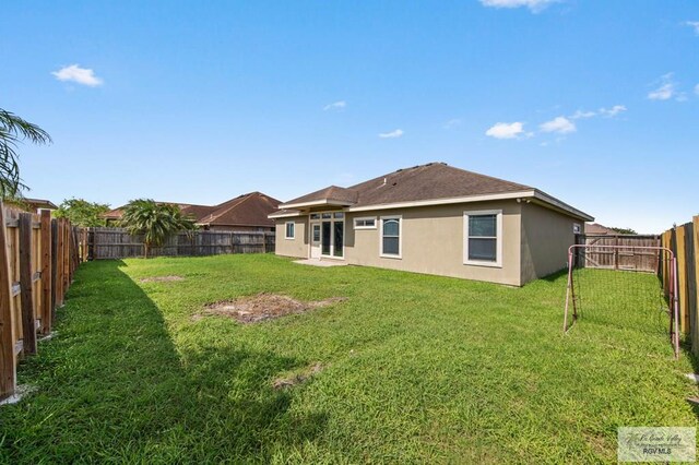 7136 Arroyo Blvd, Brownsville, TX 78526 - back of property featuring stucco siding