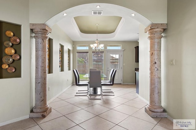 7136 Arroyo Blvd, Brownsville, TX 78526 - dining room featuring decorative columns, a chandelier, arched walkways, and light tile patterned floors