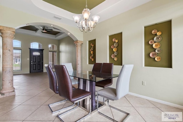 7136 Arroyo Blvd, Brownsville, TX 78526 - dining area with decorative columns, arched walkways, a raised ceiling, and light tile patterned floors